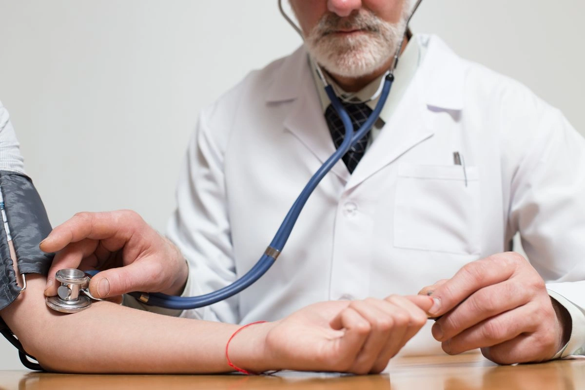 Doctor with a stethoscope preparing for a patient assessment